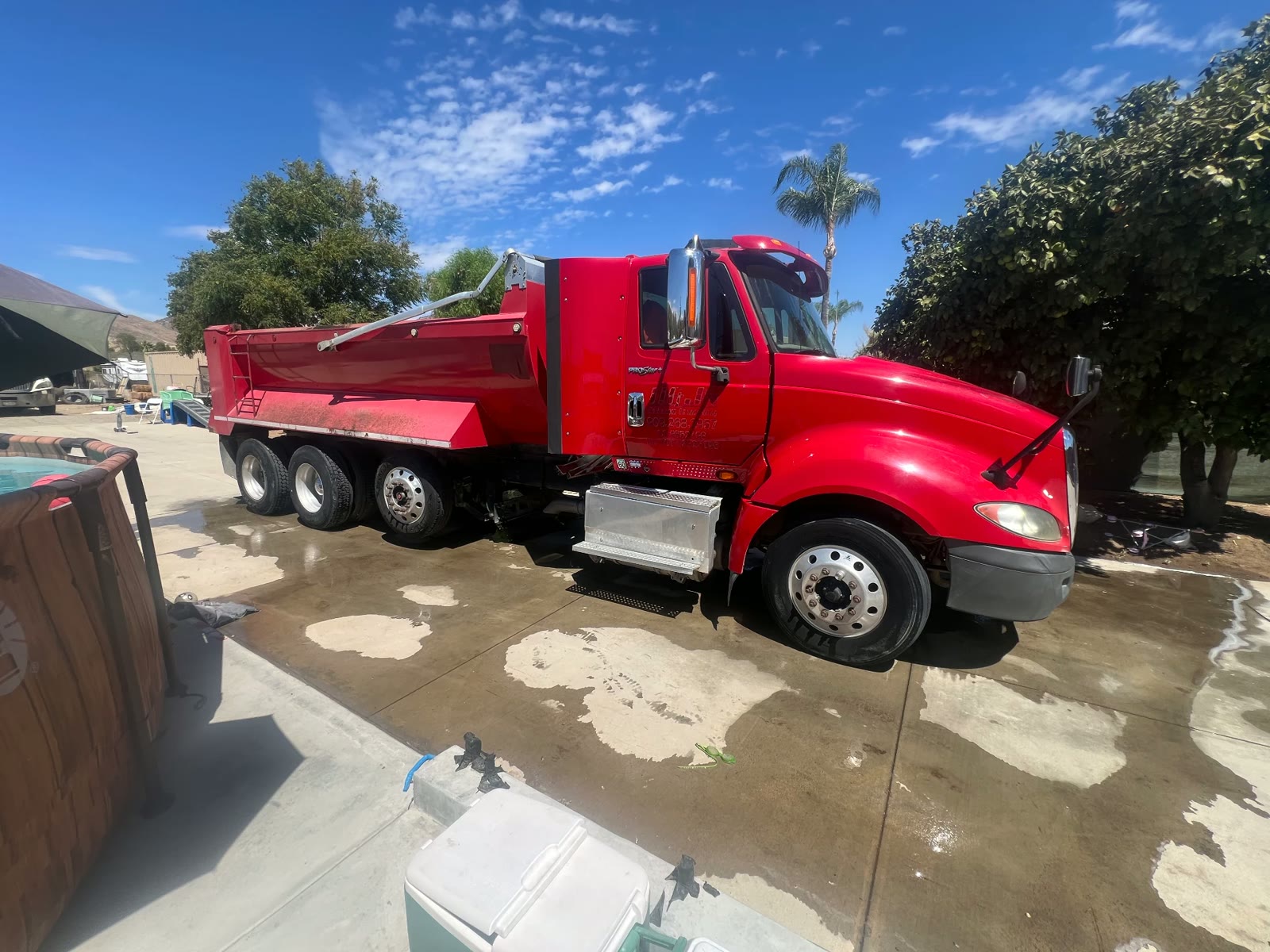 Red International ProStar 10-wheeler dump truck owned by D&J Ortega Trucking in Riverside County, CA